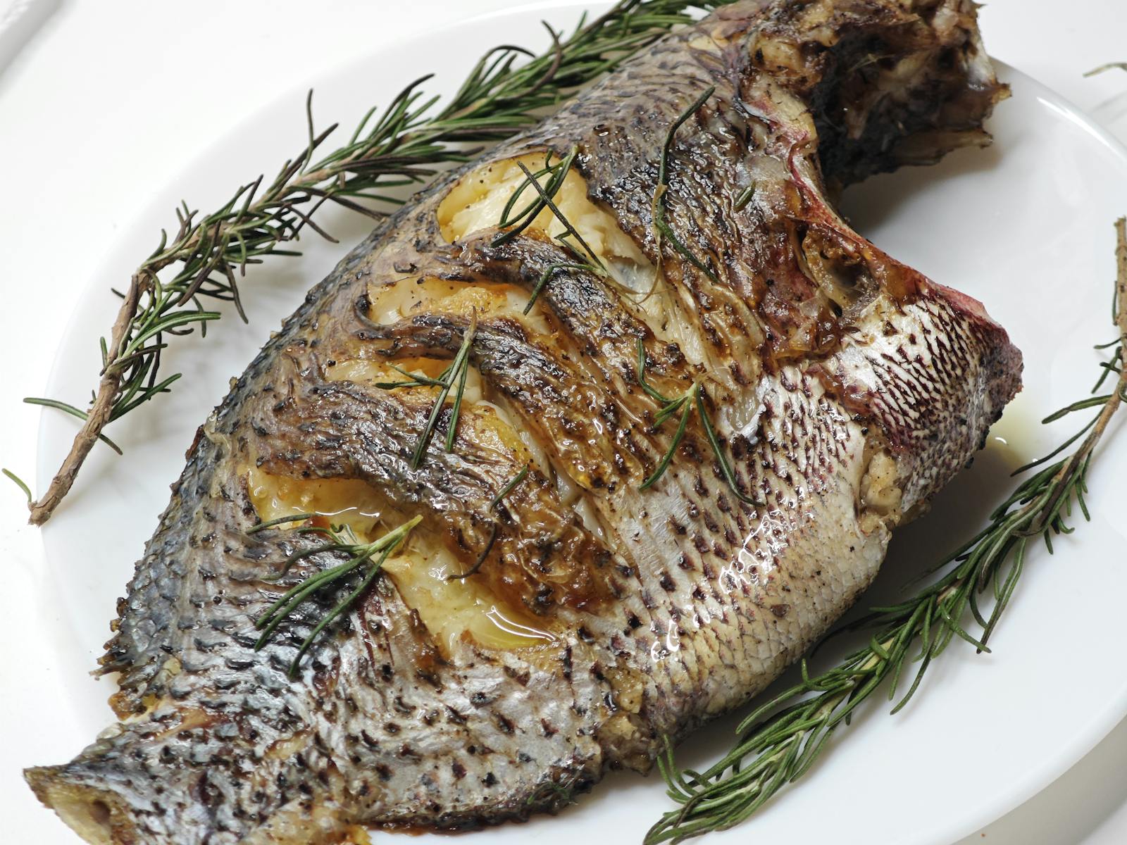 Whole grilled sea bream with rosemary