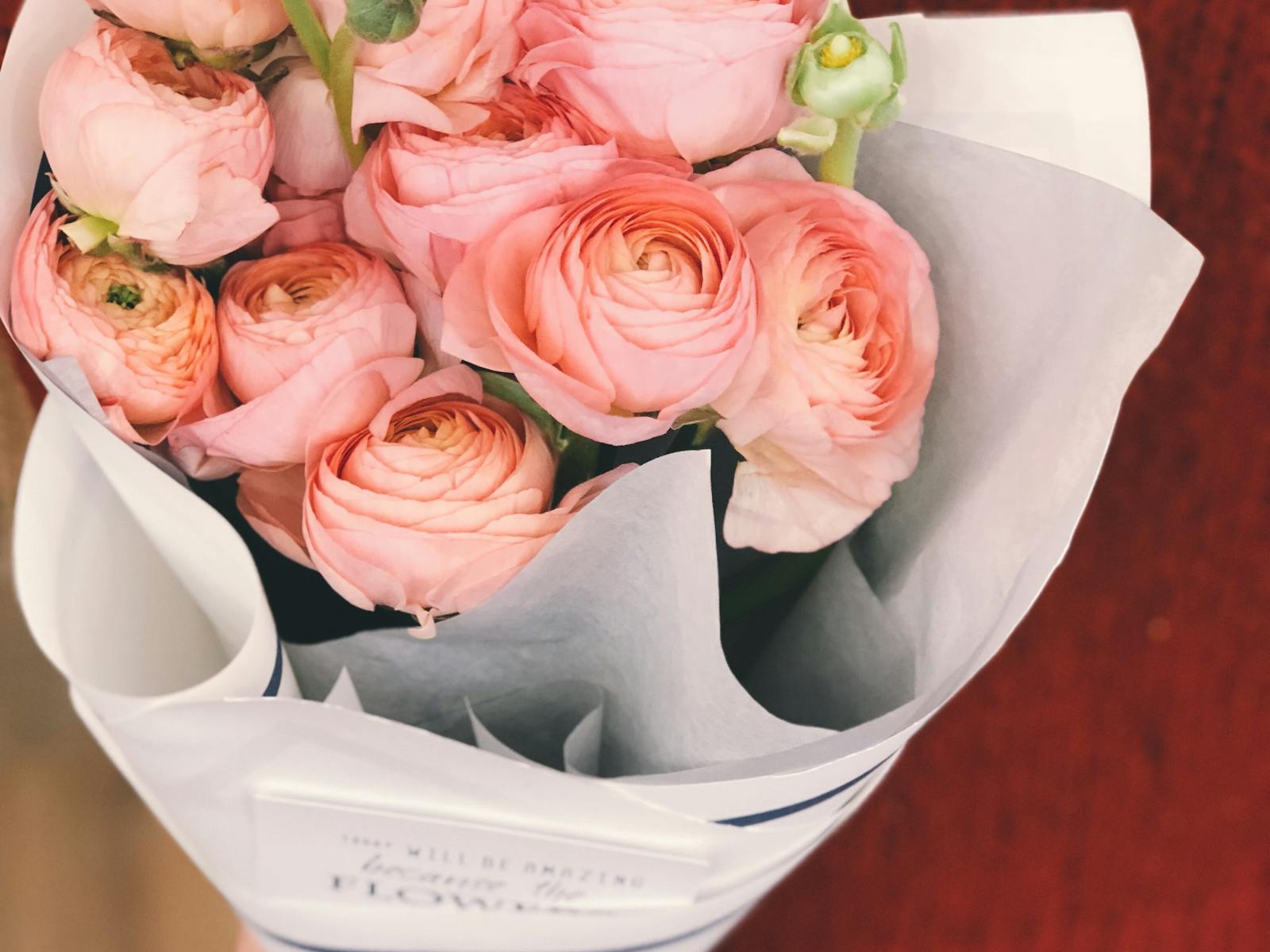 Soft pink ranunculus bouquet on a table